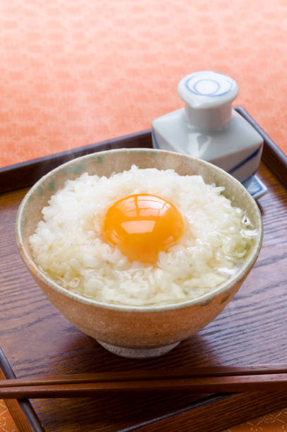istock Raw egg on the rice with soy sauce 901049474