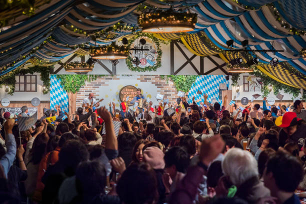 2017 Fukuoka Oktoberfest Fukuoka, Japan - October 21, 2017: A large crowd cheers on a German band during Kyushu's largest annual Oktoberfest, featuring traditional beer, food, and music for 9 days each October in Reisen Park. fukuoka city photos stock pictures, royalty-free photos & images