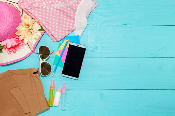 istock flat lay summer lady outfit on  blue wooden background. 901057428