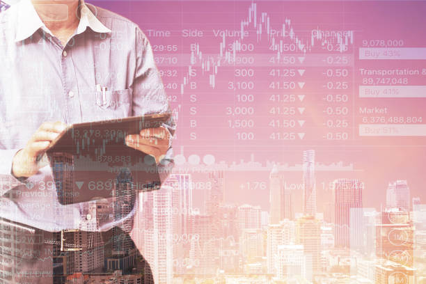 istock Man standi and operate  tablet with Abstract Business data analysis  and city skyline Background. 901060350