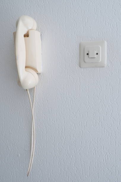 istock Old analogue telephone on a wall, The Hague 2017 901062980