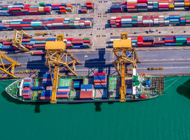 istock Logistics and transportation of Container Cargo ship and Cargo plane with working crane bridge in shipyard at sunrise, logistic import export and transport industry background 901067614