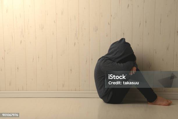 Suffering Child In Dark Room Stock Photo - Download Image Now - Child, Teenage Boys, Mental Health