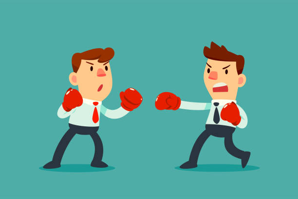 istock businessman in boxing gloves fighting against another businessman 901068342