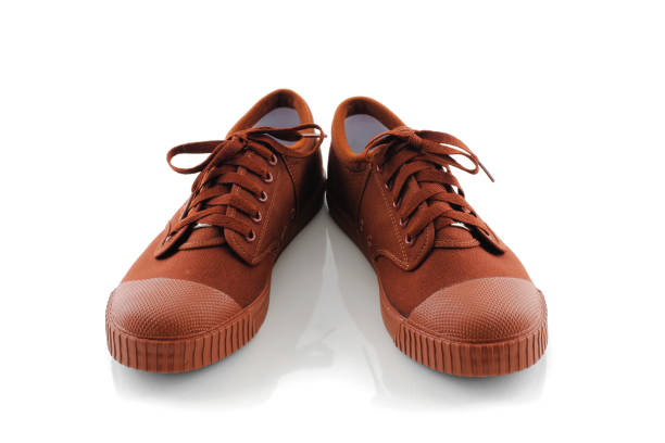 istock brown sneakers isolated on white background 901070678