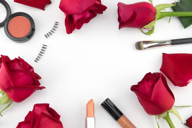 istock Cosmetics decorated with red roses on white background with copy space 901075172