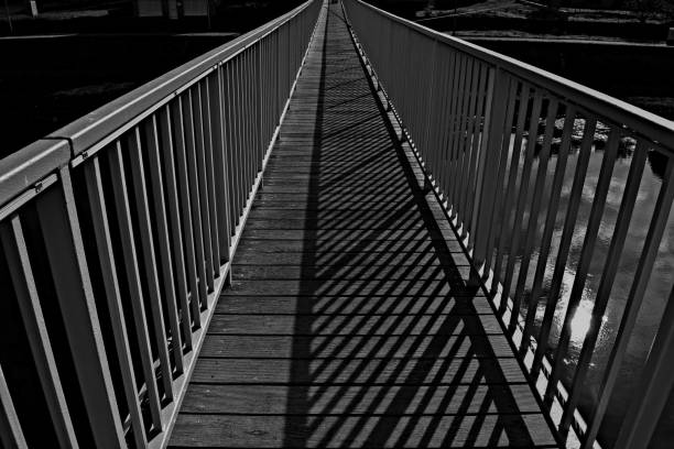 istock Old wooden bridge by the river 901078624