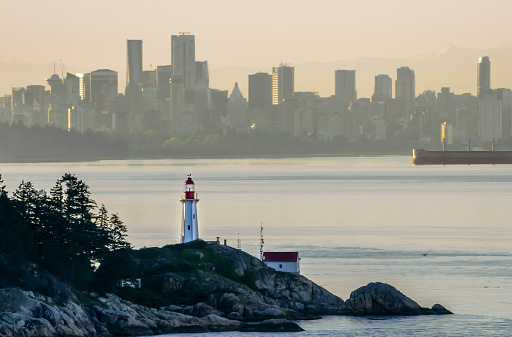 Exterior of Point Atkinson Lighthouse, modern cityscape in background, Vancouver, British Columbia, Canada.
