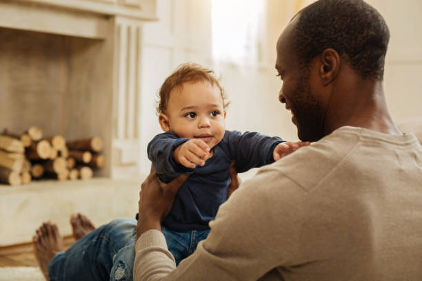 istock Alert father playing with his young son 901083264