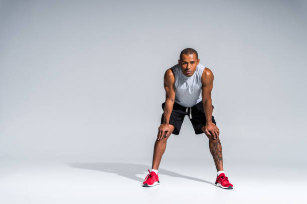 istock sportsman standing with hands on knees 901085762