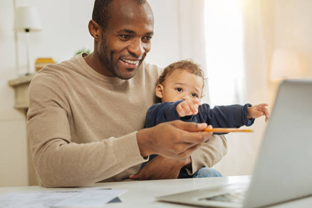 istock Happy businessman working and babysitting 901085810