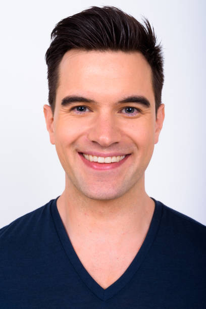 istock Portrait Of Handsome Young Man Against White Background 901085996