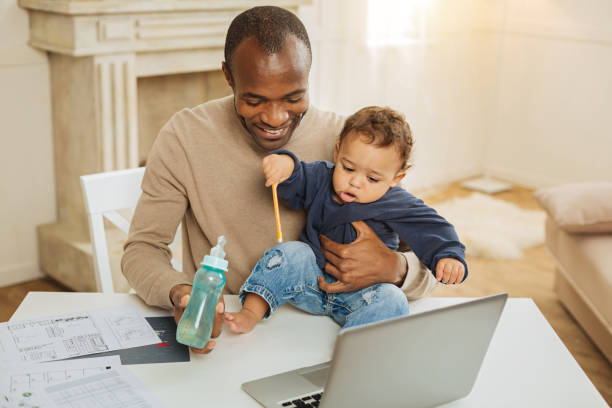 istock Loving daddy feeding his little boy 901086000