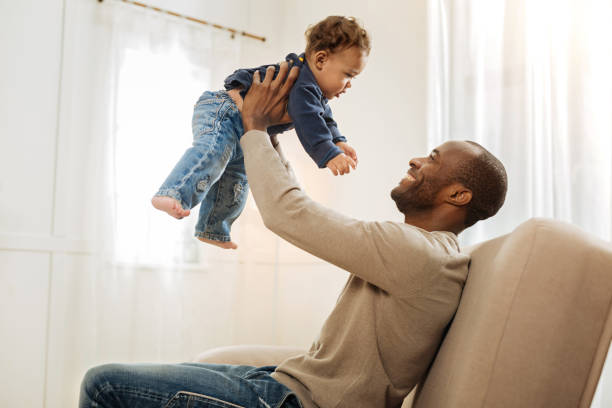 istock Loving father playing with his son 901086048