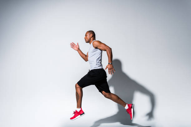 istock sportsman running on grey 901086352