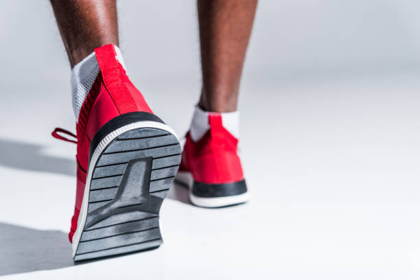 istock sportsman in sneakers on grey 901088638