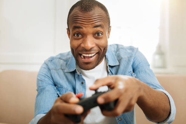 istock Inspired man relaxing and playing games 901088786