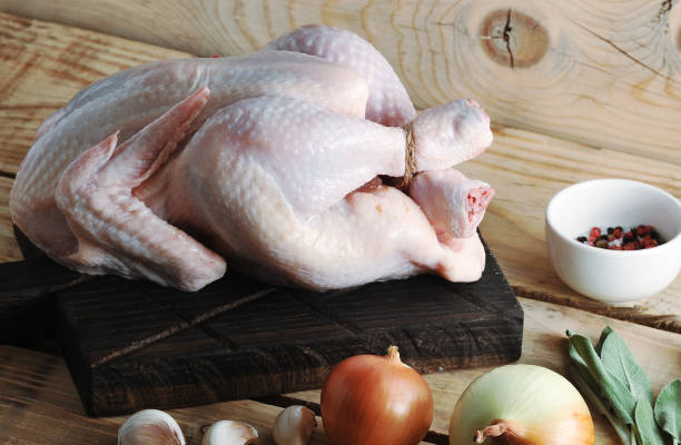istock whole raw chicken carcass on the Board and spices 901089554