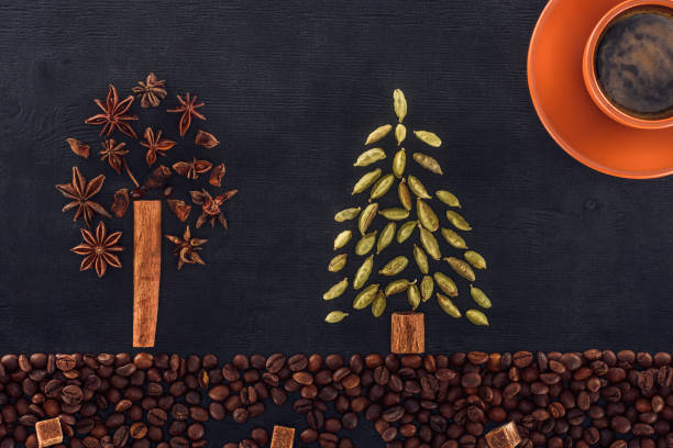 istock roasted coffee beans with sugar, cup of coffee and trees 901090248