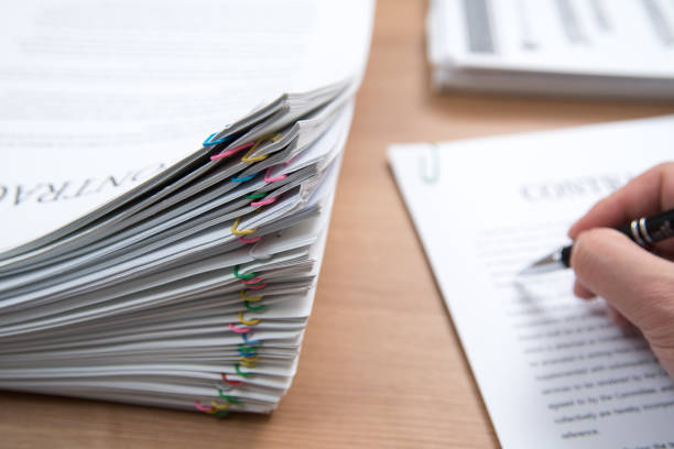 istock A pile of documents with the man in the document 901092496