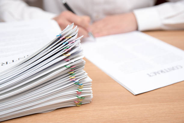 istock A pile of documents with the man in the document 901092564