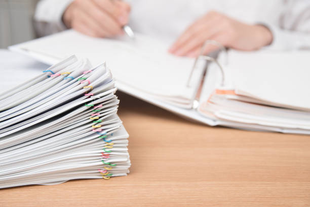 istock A pile of documents with the man in the document 901092622