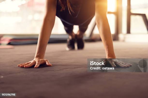 Close Up Woman Hand Doing Push Ups Exercise In A Gym In Morning Sunlight Effect Stock Photo - Download Image Now