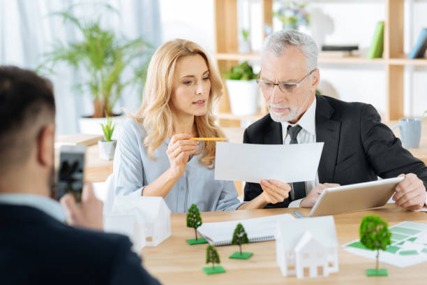 istock Serious responsible woman showing an important point in a document 901097644