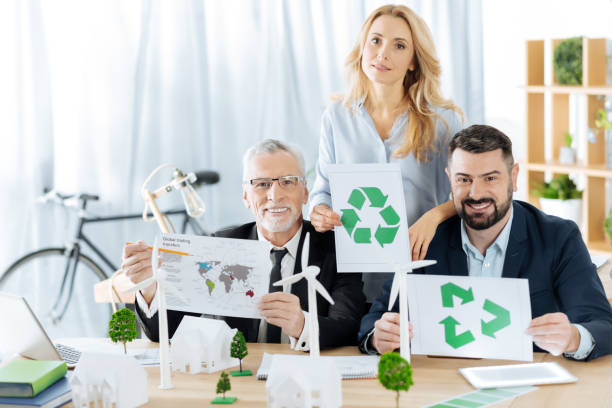 istock Conscious engineers showing recycling symbols and feeling confident 901098016