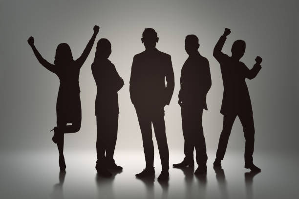 istock Silhouette group of business people with cheerful expression 901108600