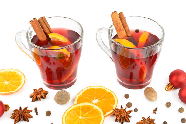 istock Hot red mulled wine isolated on white background with spices, orange slice, anise and cinnamon sticks, close up. Flat lay, top view. 901109630