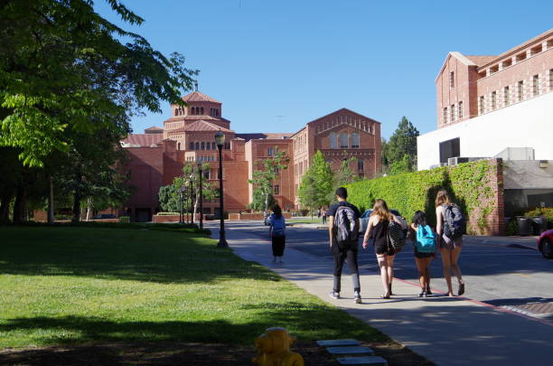 Campus ‘University of California, Los Angeles’ Los Angeles, California, USA - May 2, 2017. The location is University of California, Los Angeles. Large group of students walking about at the University campus. ucla photos stock pictures, royalty-free photos & images