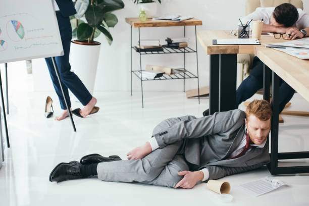istock group of exhausted businesspeople sleeping at office 901113488