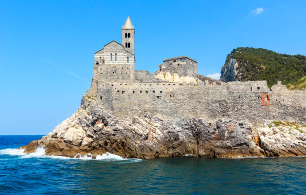 Portovenere, Liguria, Italy Beautiful medieval fisherman town of Portovenere (UNESCO Heritage Site) view from sea (near Cinque Terre, Liguria, Italy). Church Chiesa di San Pietro. church of san pietro photos stock pictures, royalty-free photos & images