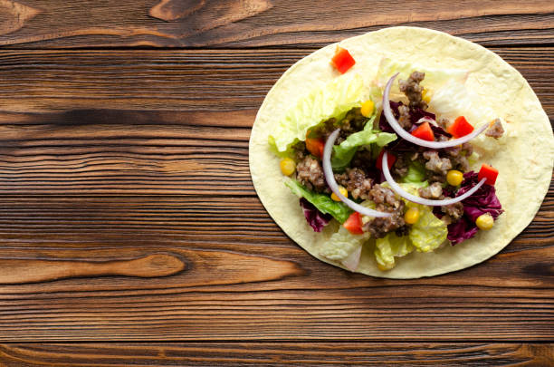 istock tacos on wooden table 901117322