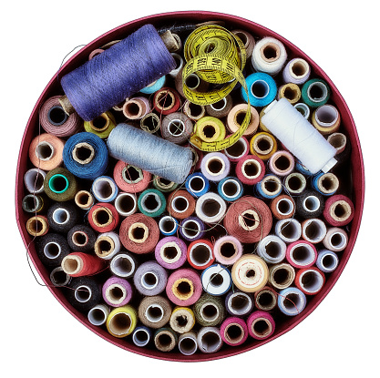 Directly Above View Of Sewing Items On round Cardboard Box