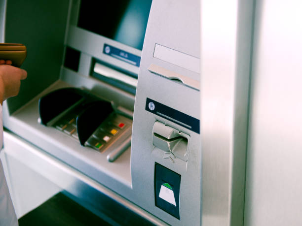 istock ATM Automatic Teller Machine and woman 901120778
