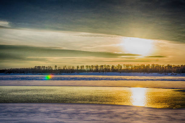 istock sunset on the river in winter 901121464