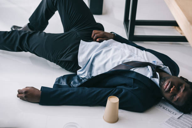 istock tired african american businessman sleeping at office 901121480