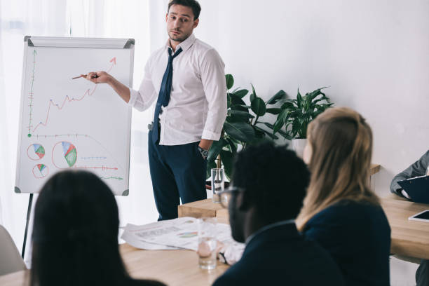istock untidy young businessman making presentation at office 901124746