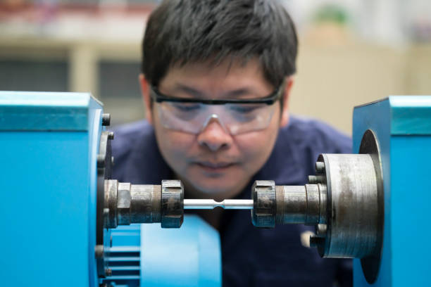 istock young asian engineer set up and testing test piece machine in the laboratory factory, engineering and industrial concept 901125508
