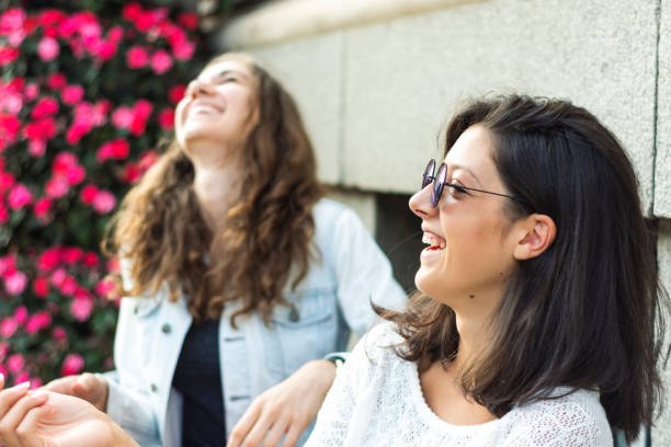 istock Two young women enjoying their company 901126088