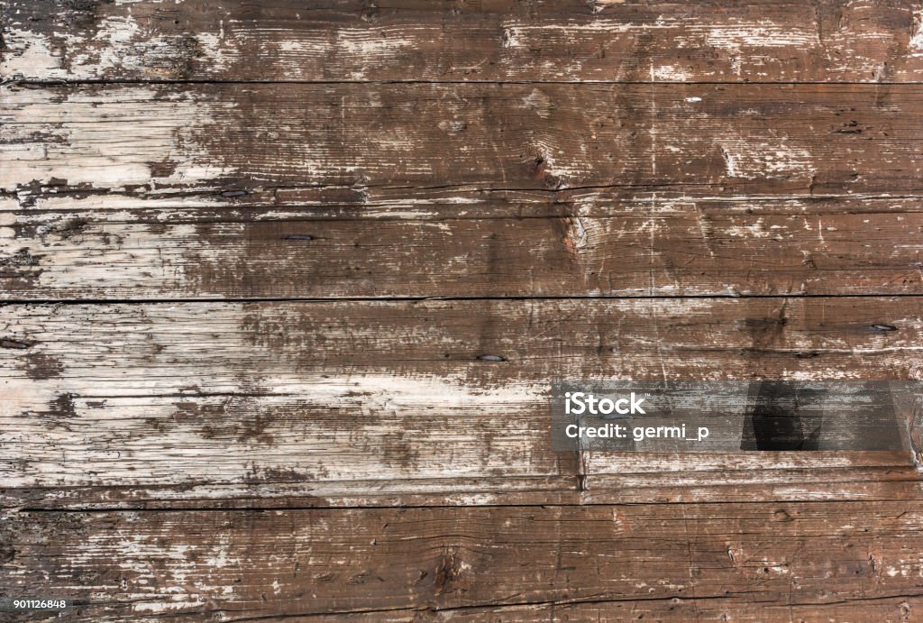 Weathered wooden background Old wooden plankswith peeling paint. Background of old painted wood fragment. Wood - Material Stock Photo