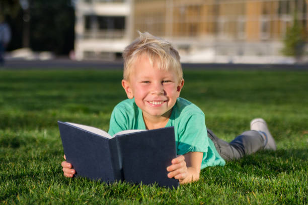 istock Cute schoolboy with books and a backpack 901130410