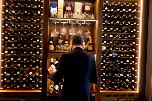 istock Handsome mature man tasting red wine 901130824