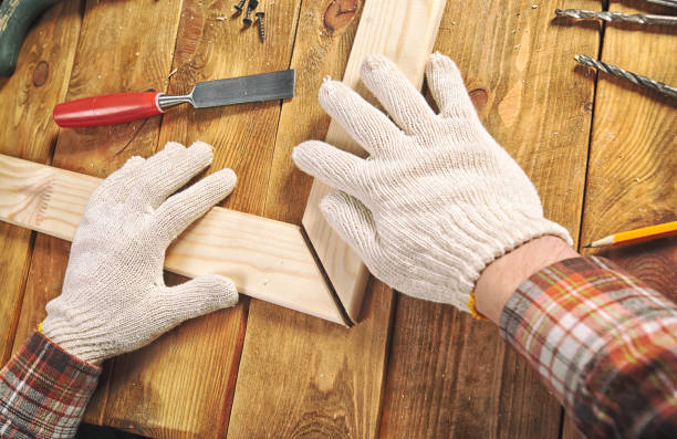 istock The carpenter works with wood on his workspace 901130956