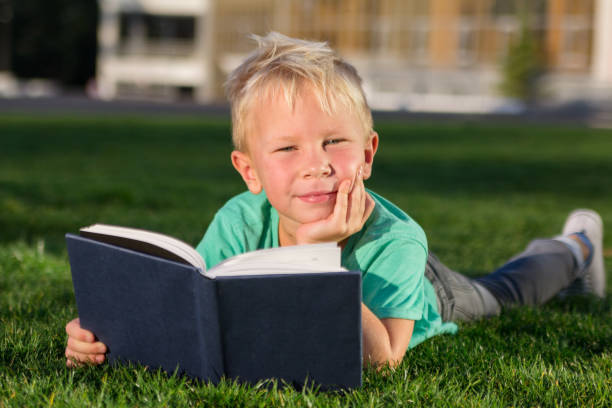 istock Cute schoolboy with books and a backpack 901130976