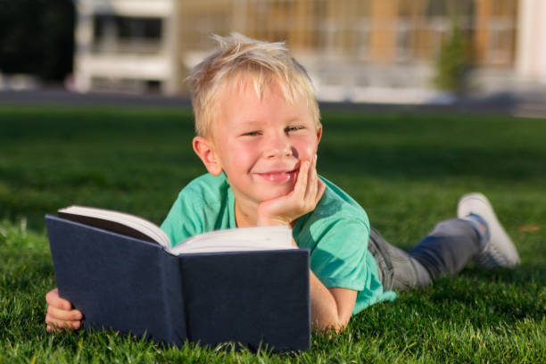 istock Cute schoolboy with books and a backpack 901131380