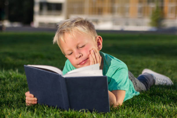 istock Cute schoolboy with books and a backpack 901133580