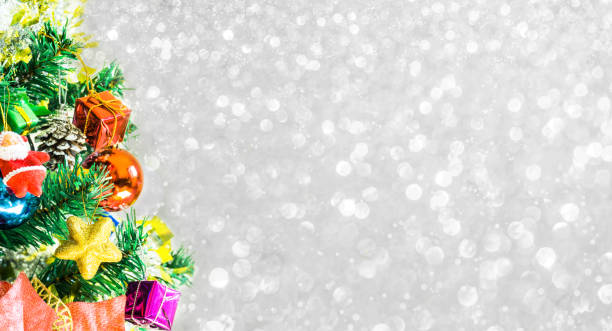 istock Tree and Christmas decorations. Beautiful decorated with present boxes in a winter landscape with snow. 901133834